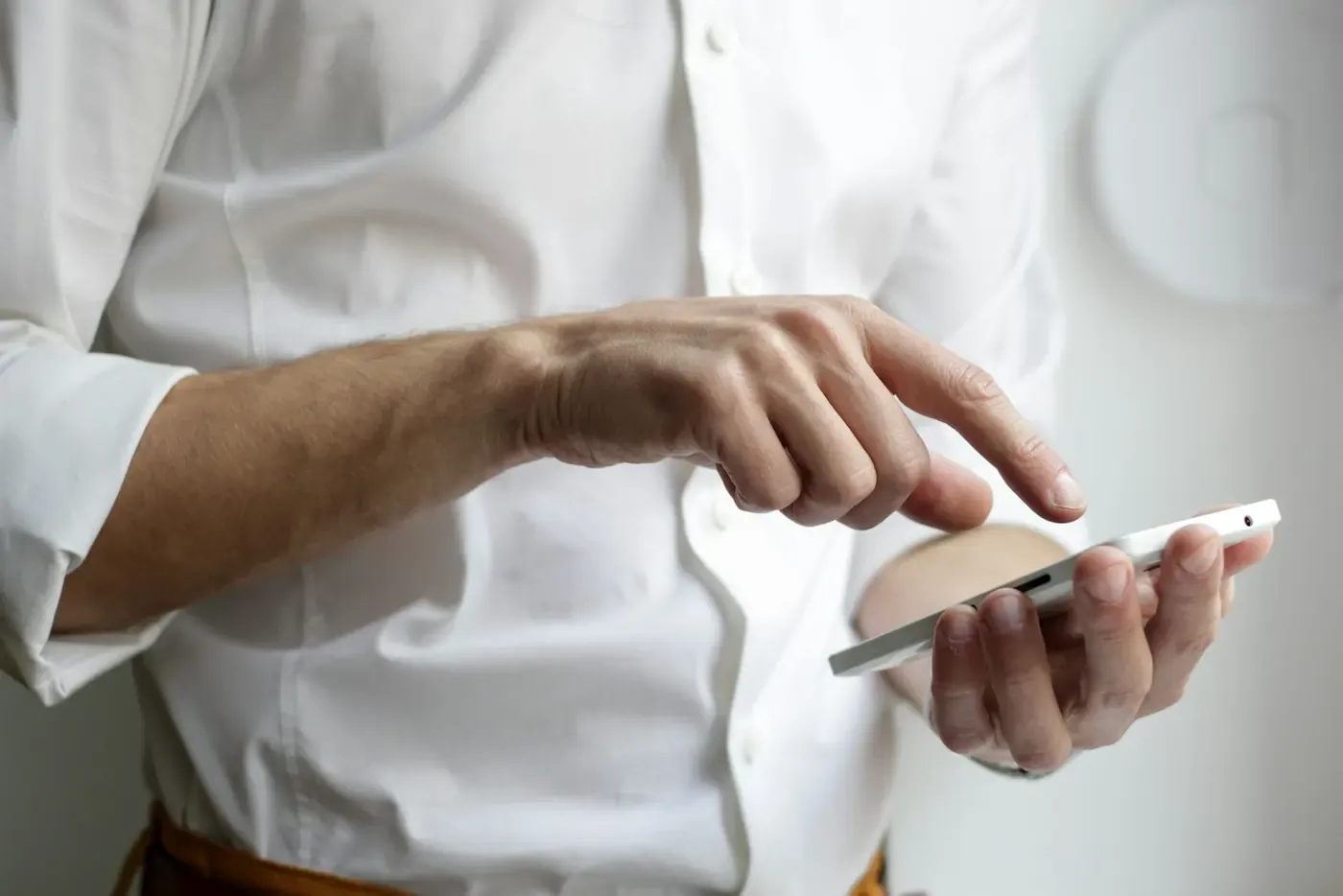 Hands using a smartphone.