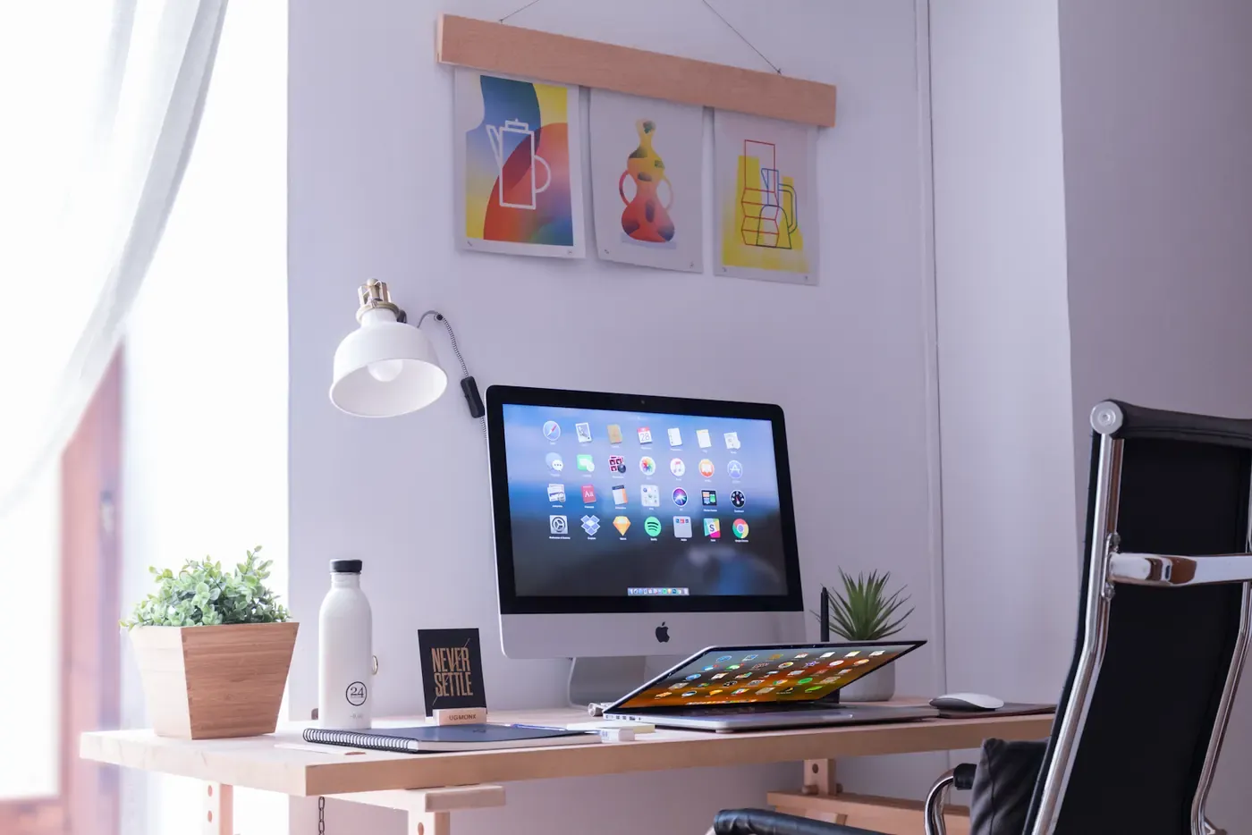 Desktop computer and tablet in a bright creative workspace.