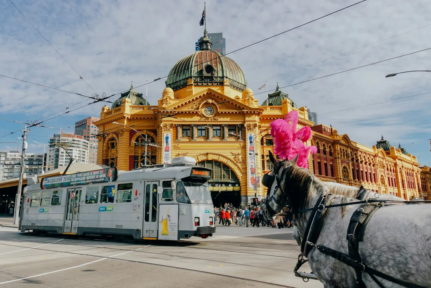 Tram passing Flinders Street Station in Melbourne.
